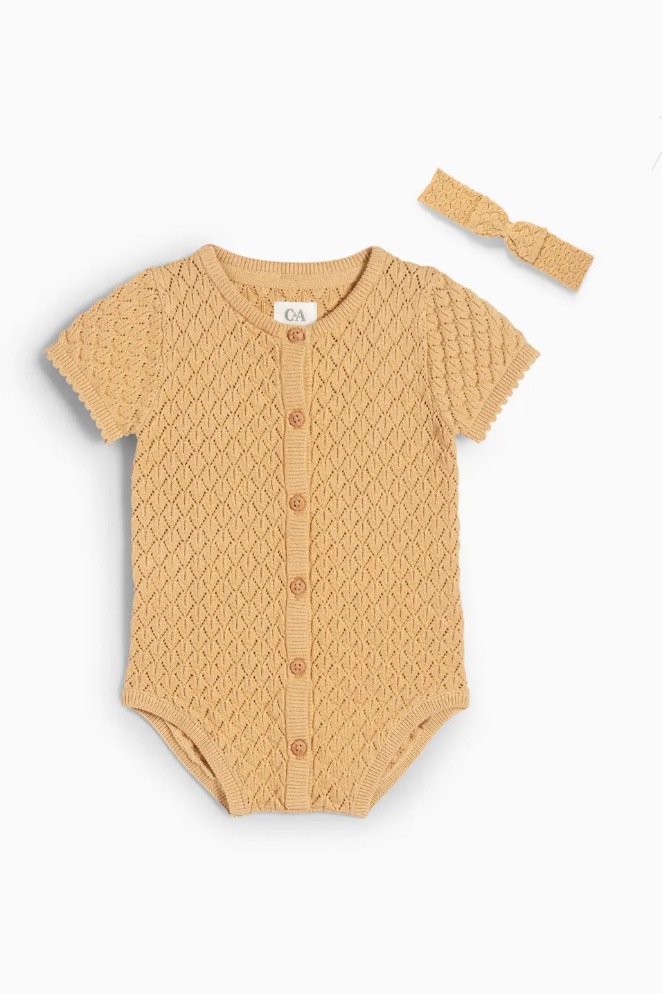 Structured knit romper with openwork pattern