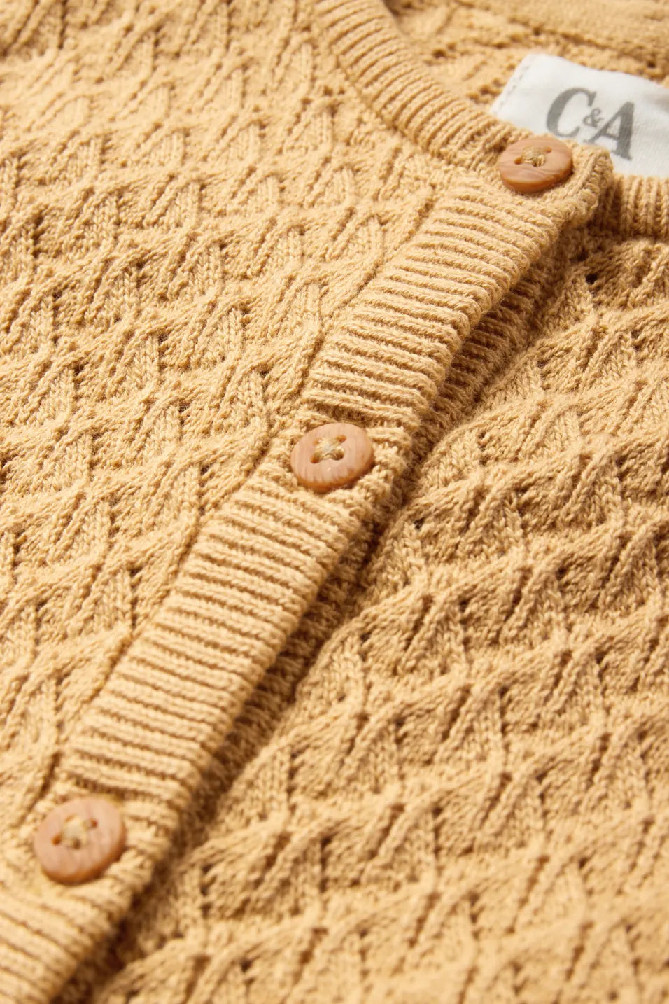 Structured knit romper with openwork pattern
