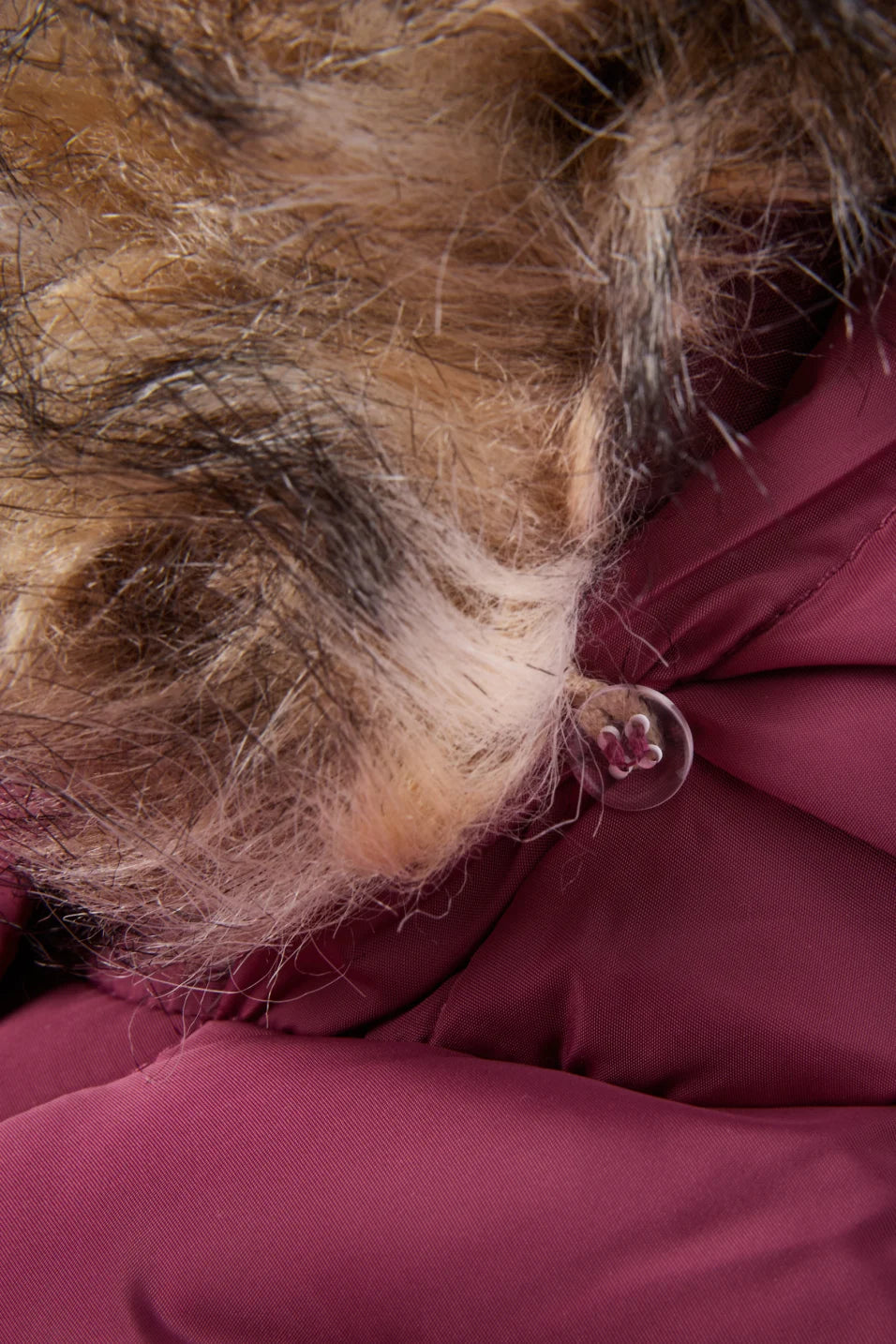 Quilted jacket with hood and faux fur trim