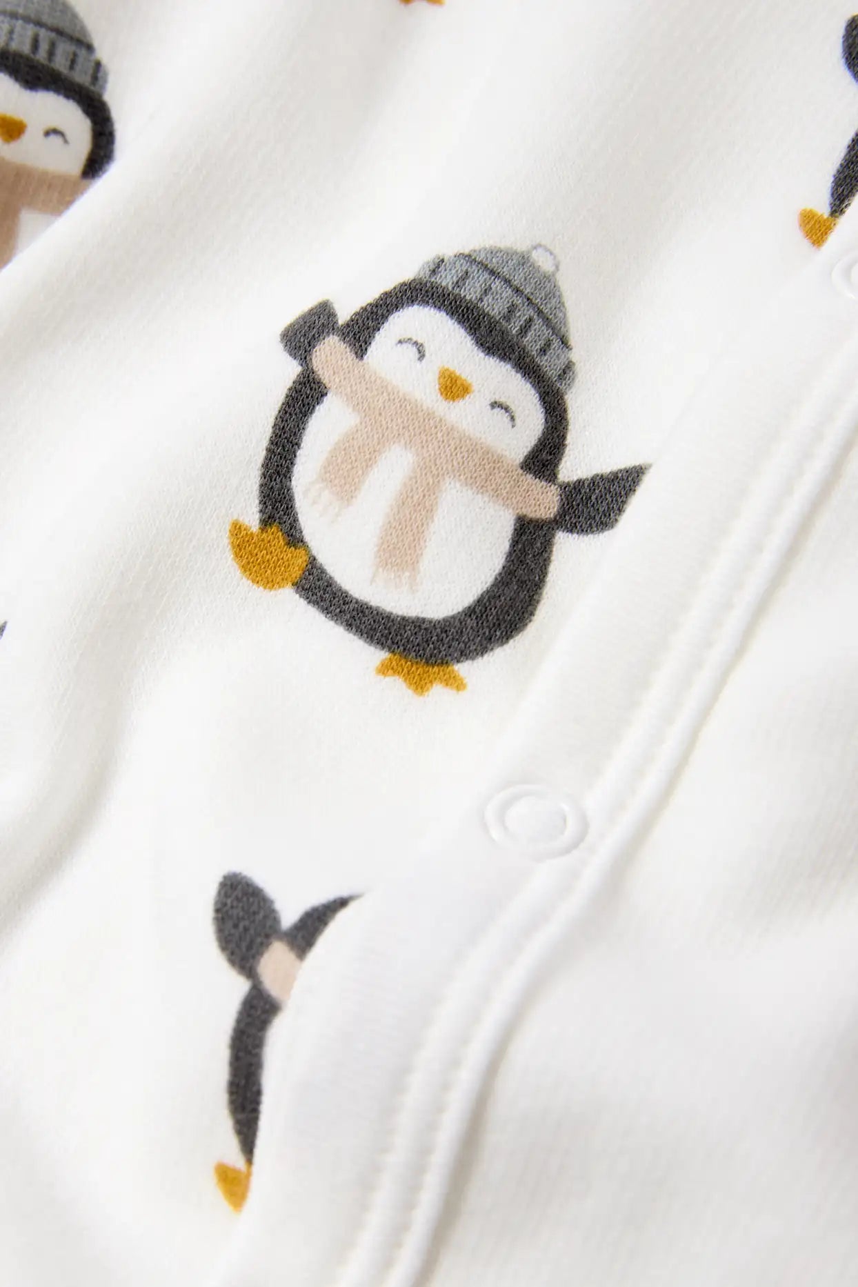 Penguin lined sleepsuit