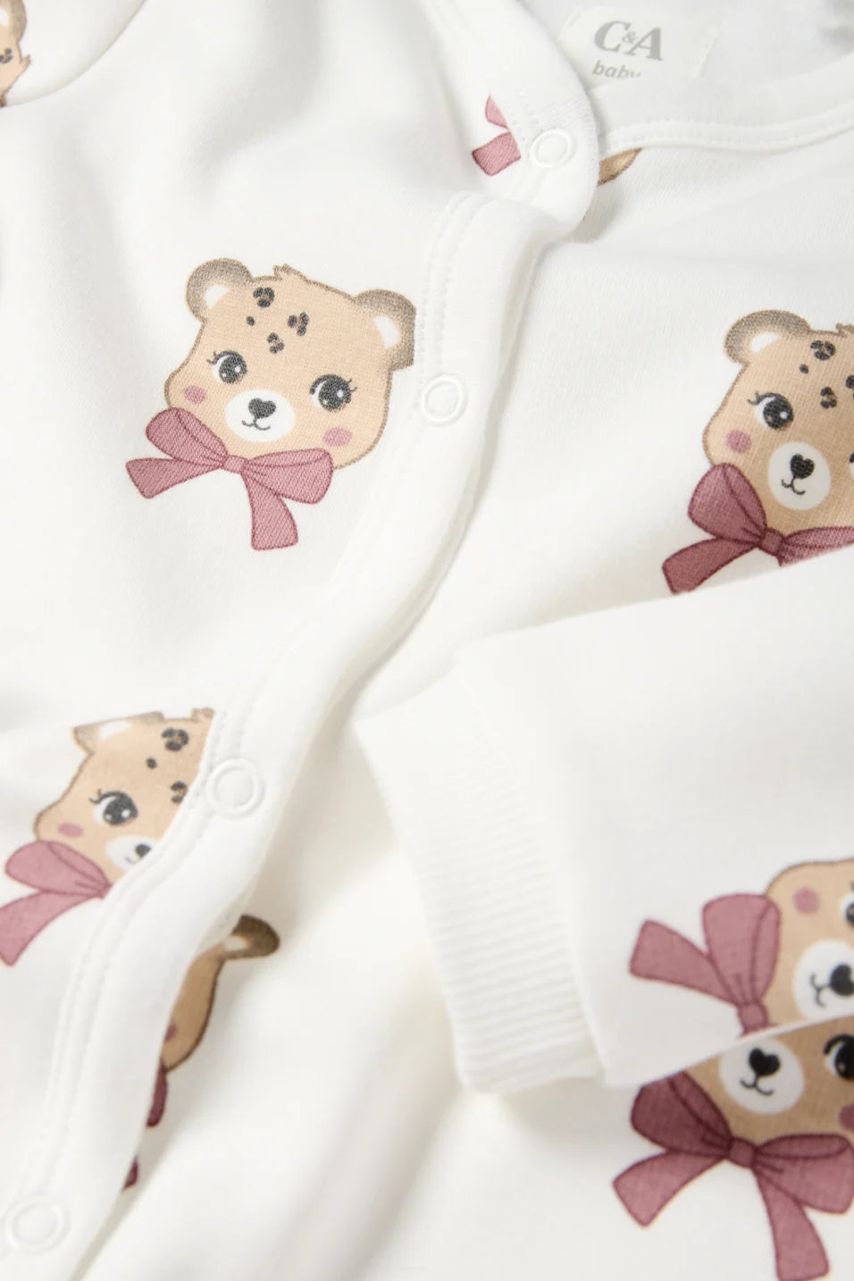 Leopard- lined sleepsuit