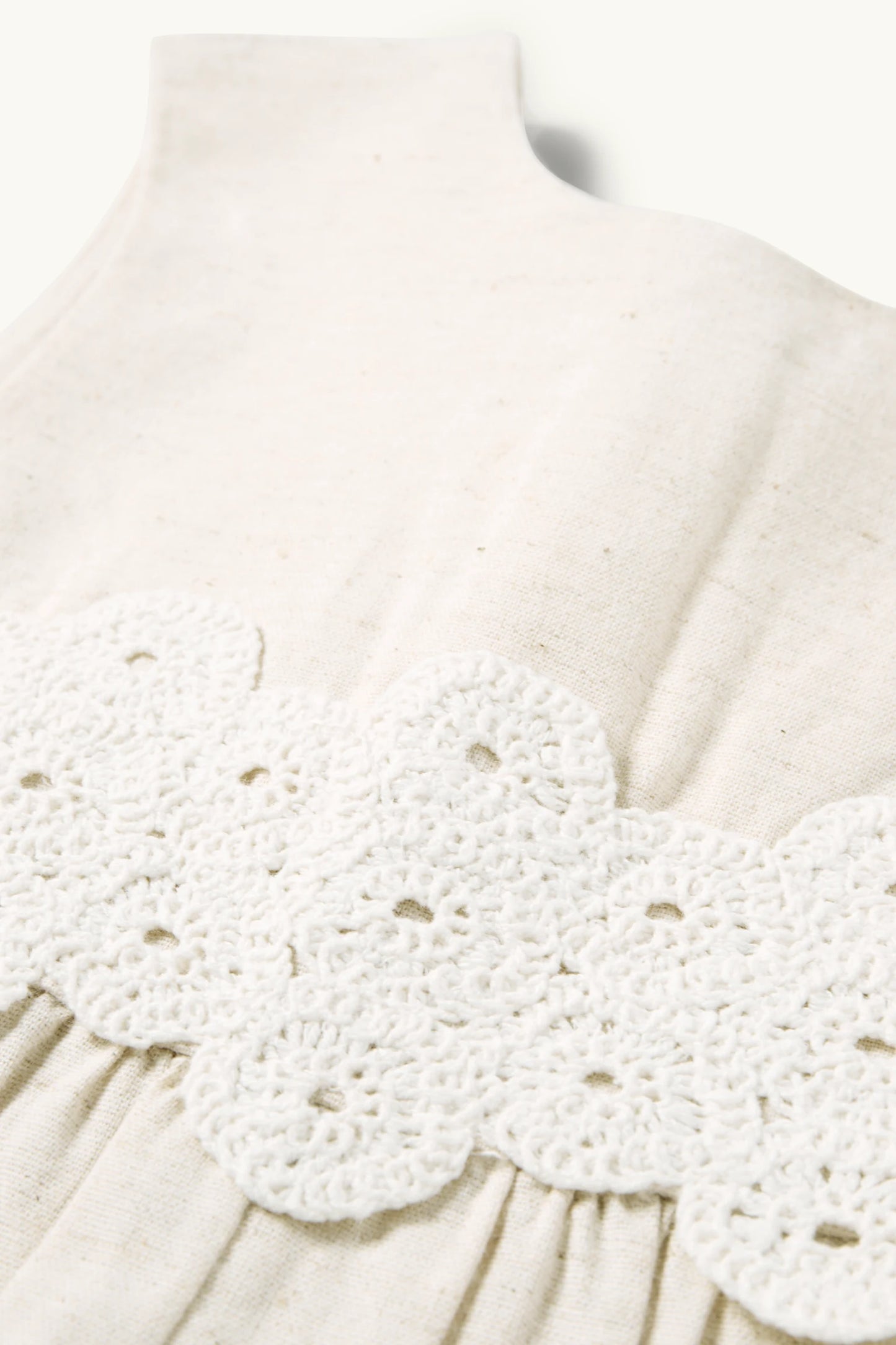 Crocheted linen baby jumpsuit
